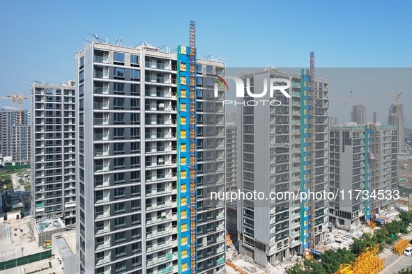 An aerial photo taken in Hangzhou, China, on November 3, 2024, shows a newly built commercial housing complex. According to the Ministry of...