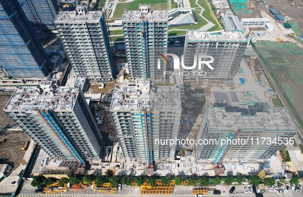 An aerial photo taken in Hangzhou, China, on November 3, 2024, shows a newly built commercial housing complex. According to the Ministry of...