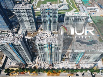 An aerial photo taken in Hangzhou, China, on November 3, 2024, shows a newly built commercial housing complex. According to the Ministry of...