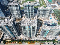 An aerial photo taken in Hangzhou, China, on November 3, 2024, shows a newly built commercial housing complex. According to the Ministry of...