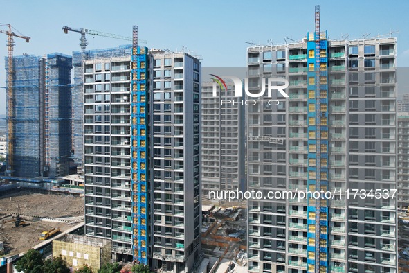 An aerial photo taken in Hangzhou, China, on November 3, 2024, shows a newly built commercial housing complex. According to the Ministry of...