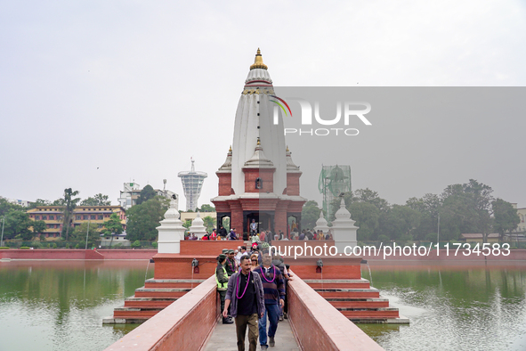 People return after participating in the Bhaitika pooja at Balgopaleshwar Temple in Kathmandu, Nepal, on November 3, 2024. 