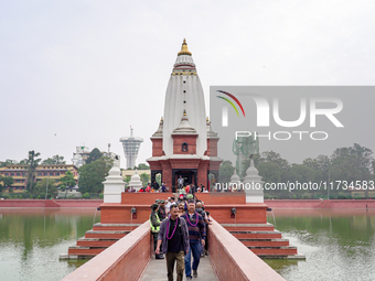 People return after participating in the Bhaitika pooja at Balgopaleshwar Temple in Kathmandu, Nepal, on November 3, 2024. (