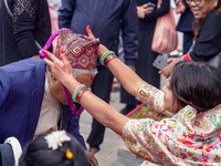 A sister applies tika on her brother's forehead, symbolizing protection and blessings, on the occasion of Bhaitika at Balgopaleshwar Temple...