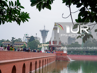 People walk to participate in the Bhaitika pooja at Balgopaleshwar Temple in Kathmandu, Nepal, on November 3, 2024. (