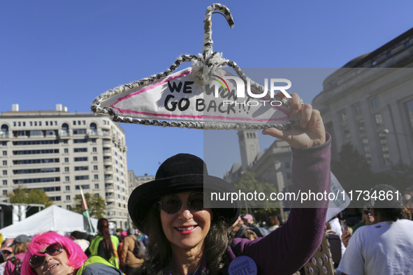 Demonstrators gather at Freedom Plaza and then march to the White House during the National Women's March ahead of the U.S. presidential ele...