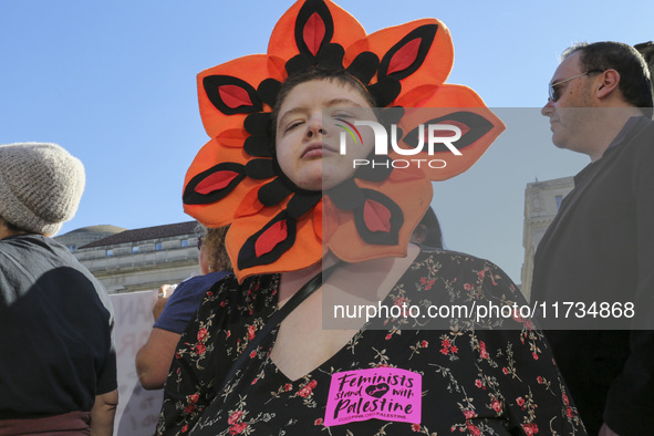 Demonstrators gather at Freedom Plaza and then march to the White House during the National Women's March ahead of the U.S. presidential ele...