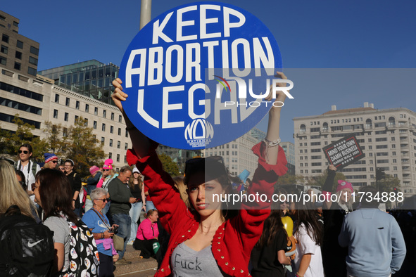 Demonstrators gather at Freedom Plaza and then march to the White House during the National Women's March ahead of the U.S. presidential ele...