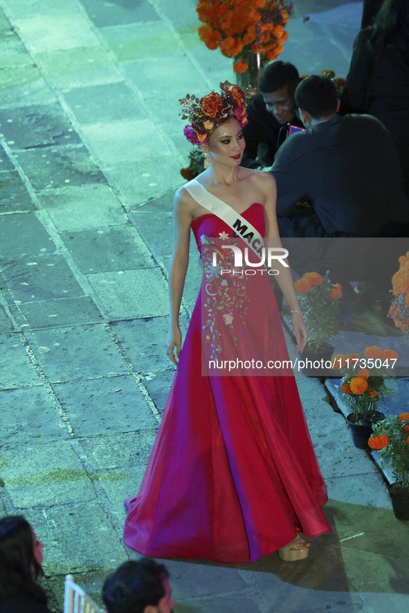 Miss Macau Cassandra Chiu walks on the runway during the Miss Universe Catrinas Gala at Antiguo Colegio de las Vizcainas in Mexico City, Mex...