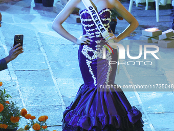 Miss Greece Christianna Katsieri walks on the runway during the Miss Universe Catrinas Gala at Antiguo Colegio de las Vizcainas in Mexico Ci...