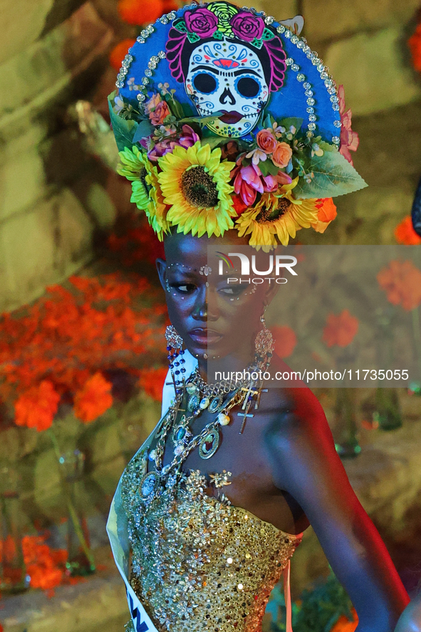 Miss Botswana Thanolo Thato walks on the runway during the Miss Universe Catrinas Gala at Antiguo Colegio de las Vizcainas in Mexico City, M...