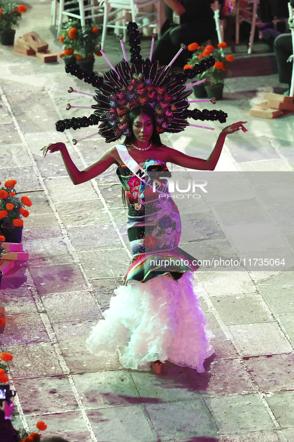 Miss Namibia Prisca Anyolo walks on the runway during the Miss Universe Catrinas Gala at Antiguo Colegio de las Vizcainas in Mexico City, Me...