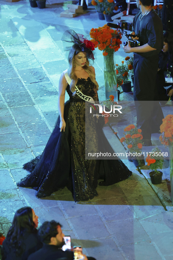 Miss Turkey Ayliz Duman walks on the runway during the Miss Universe Catrinas Gala at Antiguo Colegio de las Vizcainas in Mexico City, Mexic...