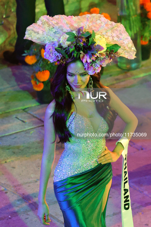 Miss Thailand Suchata Chuangsri walks on the runway during the Miss Universe Catrinas Gala at Antiguo Colegio de las Vizcainas in Mexico Cit...