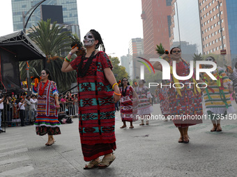 Participants take part in the 2024 Annual Day of the Dead Mega Parade on Reforma Avenue, with a route from Chapultepec to the main square Zo...