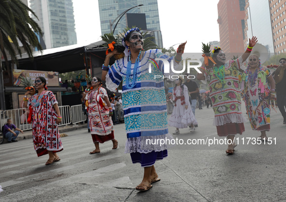 Participants take part in the 2024 Annual Day of the Dead Mega Parade on Reforma Avenue, with a route from Chapultepec to the main square Zo...