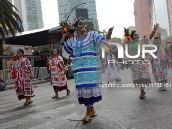 Participants take part in the 2024 Annual Day of the Dead Mega Parade on Reforma Avenue, with a route from Chapultepec to the main square Zo...