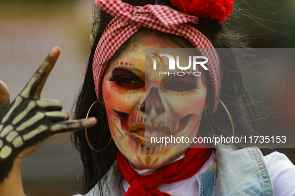 Participants take part in the 2024 Annual Day of the Dead Mega Parade on Reforma Avenue, with a route from Chapultepec to the main square Zo...