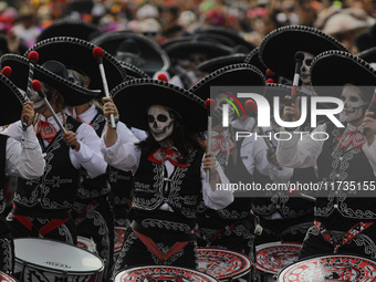 Participants take part in the 2024 Annual Day of the Dead Mega Parade on Reforma Avenue, with a route from Chapultepec to the main square Zo...