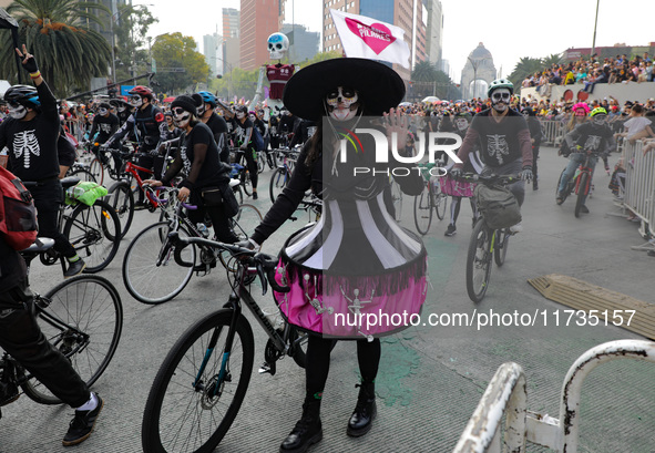 Participants take part in the 2024 Annual Day of the Dead Mega Parade on Reforma Avenue, with a route from Chapultepec to the main square Zo...