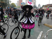 Participants take part in the 2024 Annual Day of the Dead Mega Parade on Reforma Avenue, with a route from Chapultepec to the main square Zo...