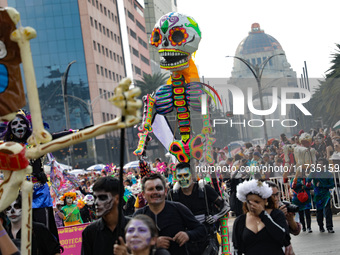 Participants take part in the 2024 Annual Day of the Dead Mega Parade on Reforma Avenue, with a route from Chapultepec to the main square Zo...