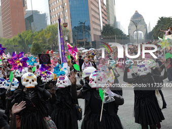 Participants take part in the 2024 Annual Day of the Dead Mega Parade on Reforma Avenue, with a route from Chapultepec to the main square Zo...