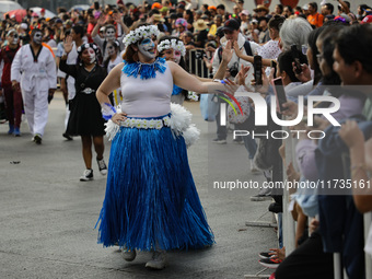 Participants take part in the 2024 Annual Day of the Dead Mega Parade on Reforma Avenue, with a route from Chapultepec to the main square Zo...