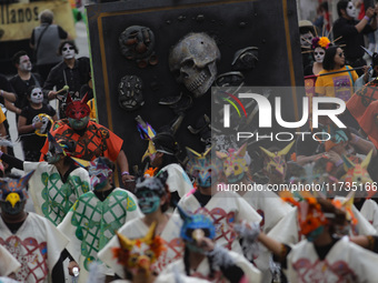 Participants take part in the 2024 Annual Day of the Dead Mega Parade on Reforma Avenue, with a route from Chapultepec to the main square Zo...