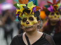 Participants take part in the 2024 Annual Day of the Dead Mega Parade on Reforma Avenue, with a route from Chapultepec to the main square Zo...