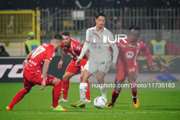 Tijjani Reijnders (AC Milan) and Warren Bondo (AC Monza) participate in the Italian championship Serie A football match between AC Monza and...