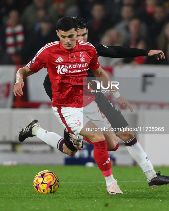 Ramon Sosa of Nottingham Forest is under pressure from Carlos Soler of West Ham United during the Premier League match between Nottingham Fo...