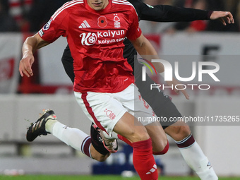 Ramon Sosa of Nottingham Forest is under pressure from Carlos Soler of West Ham United during the Premier League match between Nottingham Fo...