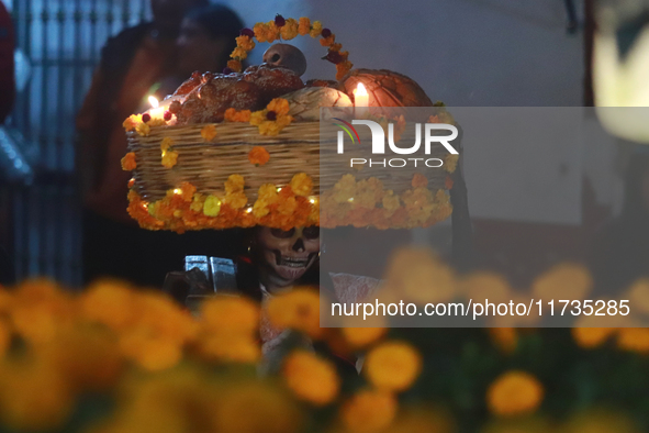 A person takes part in the Annual Day of the Dead Catrinas Parade at the Sanctuary of Guadalupe as part of Mexican Dia de Muertos celebratio...