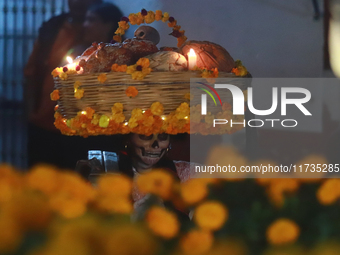 A person takes part in the Annual Day of the Dead Catrinas Parade at the Sanctuary of Guadalupe as part of Mexican Dia de Muertos celebratio...