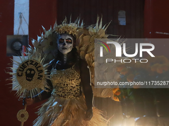 A person takes part in the Annual Day of the Dead Catrinas Parade at the Sanctuary of Guadalupe as part of Mexican Dia de Muertos celebratio...