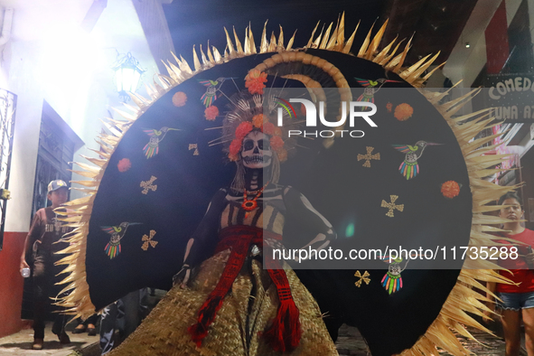 A person takes part in the Annual Day of the Dead Catrinas Parade at the Sanctuary of Guadalupe as part of Mexican Dia de Muertos celebratio...