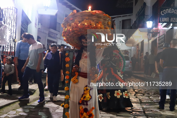 A person takes part in the Annual Day of the Dead Catrinas Parade at the Sanctuary of Guadalupe as part of Mexican Dia de Muertos celebratio...