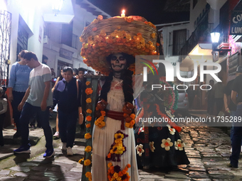 A person takes part in the Annual Day of the Dead Catrinas Parade at the Sanctuary of Guadalupe as part of Mexican Dia de Muertos celebratio...