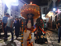 A person takes part in the Annual Day of the Dead Catrinas Parade at the Sanctuary of Guadalupe as part of Mexican Dia de Muertos celebratio...