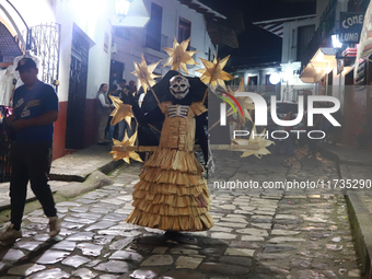 A person takes part in the Annual Day of the Dead Catrinas Parade at the Sanctuary of Guadalupe as part of Mexican Dia de Muertos celebratio...