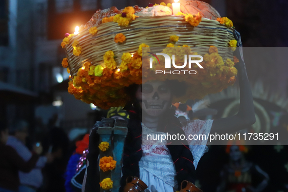 A person takes part in the Annual Day of the Dead Catrinas Parade at the Sanctuary of Guadalupe as part of Mexican Dia de Muertos celebratio...