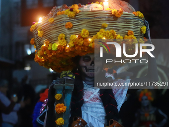 A person takes part in the Annual Day of the Dead Catrinas Parade at the Sanctuary of Guadalupe as part of Mexican Dia de Muertos celebratio...