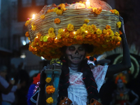 A person takes part in the Annual Day of the Dead Catrinas Parade at the Sanctuary of Guadalupe as part of Mexican Dia de Muertos celebratio...