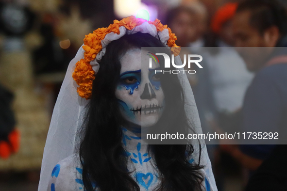 A person takes part in the Annual Day of the Dead Catrinas Parade at the Sanctuary of Guadalupe as part of Mexican Dia de Muertos celebratio...