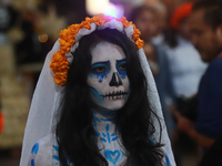 A person takes part in the Annual Day of the Dead Catrinas Parade at the Sanctuary of Guadalupe as part of Mexican Dia de Muertos celebratio...