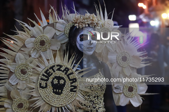 A person takes part in the Annual Day of the Dead Catrinas Parade at the Sanctuary of Guadalupe as part of Mexican Dia de Muertos celebratio...