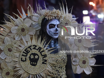 A person takes part in the Annual Day of the Dead Catrinas Parade at the Sanctuary of Guadalupe as part of Mexican Dia de Muertos celebratio...