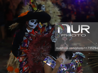 A person takes part in the Annual Day of the Dead Catrinas Parade at the Sanctuary of Guadalupe as part of Mexican Dia de Muertos celebratio...