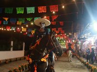 A person takes part in the Annual Day of the Dead Catrinas Parade at the Sanctuary of Guadalupe as part of Mexican Dia de Muertos celebratio...